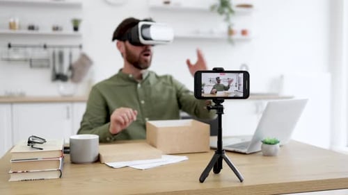 Man with Headset Recording Video at Home