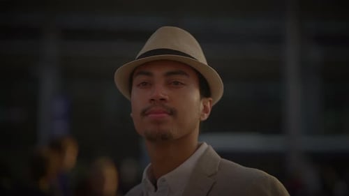 Fashionable Young Handsome Man Wearing a Hat and Casual Clothes in the City