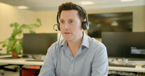 Businessman with Headset on a Video call in an Office, Telemarketing, Call centre