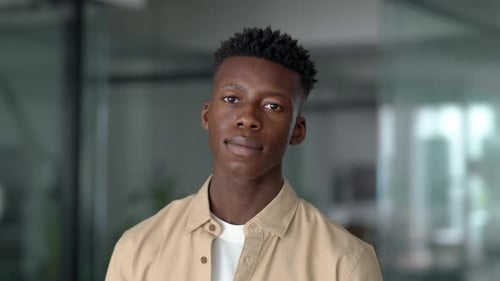 Handsome Young Adult Smiling in Workplace