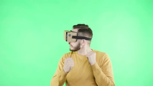 Man Boxing with VR Goggles on Green Screen