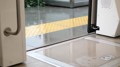Open Train Door with Safety Floor Markings in Station