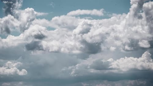 White Clouds Float Across a Blue Sky