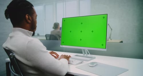 African American Marketing Manager Works on Computer with Green Screen Chroma Key