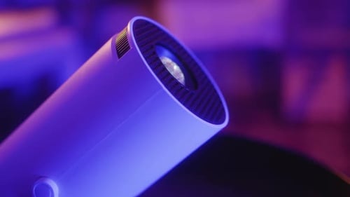 Lens with the Color Beam of a Video Projector Close Up of Movie Projector Home Movie Watching