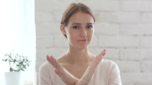 Woman Makes 'No' Gesture Indoors