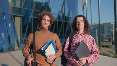 Modern Campus Students Standing Outdoors with Books and Backpacks