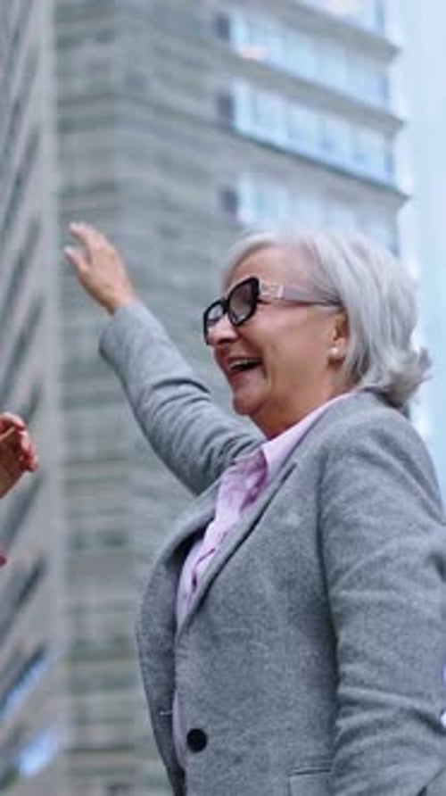 Animated Female Group of Diverse Urban Professionals Enjoy Dancing Celebrating Job Promotion Outdoor
