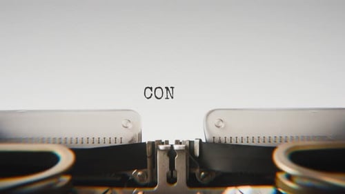 Old mechanical typewriter typing Conspiracy in a close-up view.