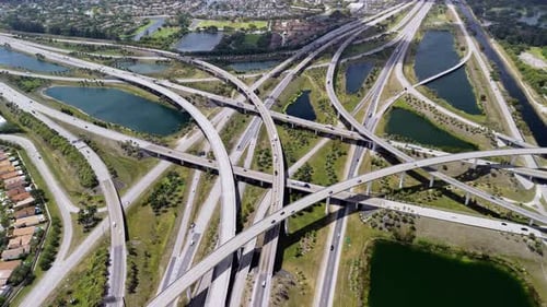 Highway Interchange in Miami City Bustling with the Fastmoving Vehicles Showcasing US Transportation