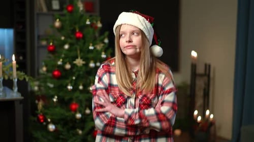 Sad Lonely Caucasian Woman Sighing Crossing Hands Standing in Living Room on Christmas Eve