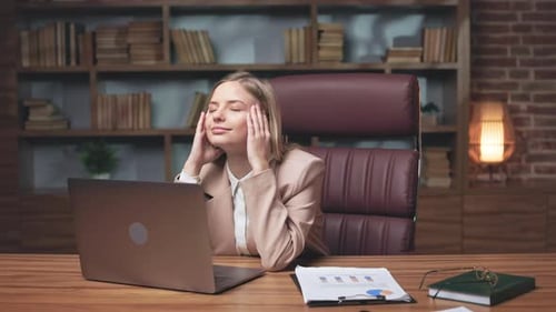 Tired Woman Having Rest After Long Work on Laptop in Office