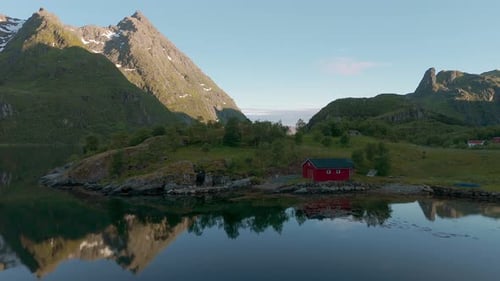 Traditional red house. Lofoten island, Norway. Scandinavia nature with sea, fjord, mountains and wat