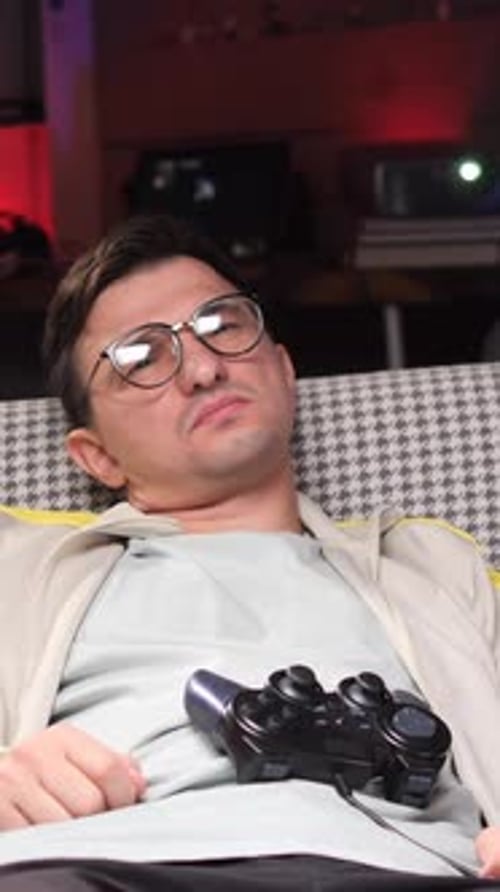 Young Adult Reclining with Video Game Controller