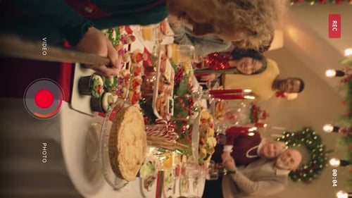 Woman Takes Family Group Photo on Christmas