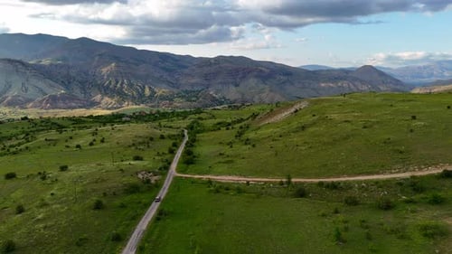 Vehicle travels winding road through