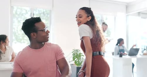 Collaboration, talking and a business woman flirting with a black man in the office while working