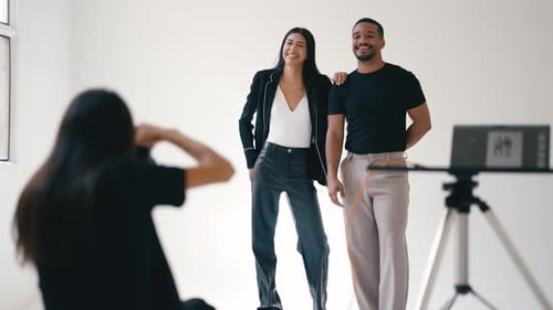 Professional Photographer Taking Pictures of Fashion Models in Photo Studio