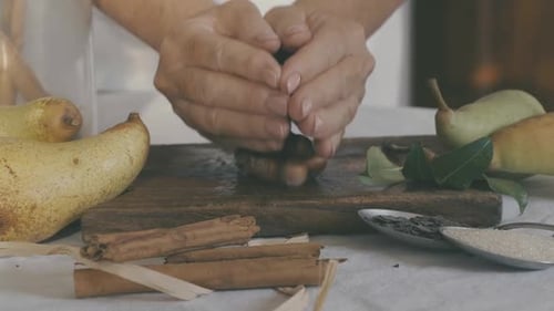 Person Prepares Nuts and Fruit for Dessert