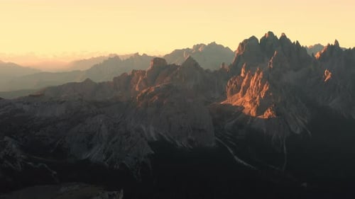 Golden Sunset Over the Jagged Peaks of Tre Cime Di Lavaredo in the Italian Alps