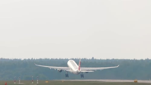 Commercial Airplane Taking off on Runway