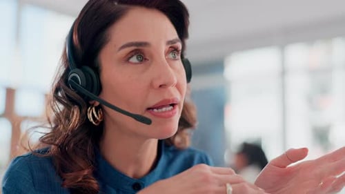 Woman, face and talking in call center for customer support, telemarketing and FAQ in office