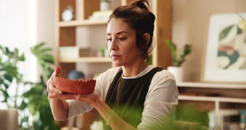 Woman, pottery and clay for design as artist in studio for project, home decor and handmade craft
