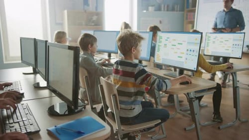 Elementary School Science Classroom: Teacher Educates Smart Little Schoolchildren who Work on Perso