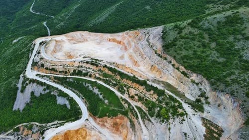 Natural Quarry is Located Near Road Against Backdrop of Rhodope Mountains and Hills with Forests and