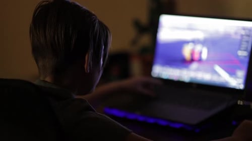 Child Plays Computer Game Late at Night