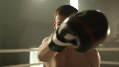 Close Up of Young Boxer Training in Ring