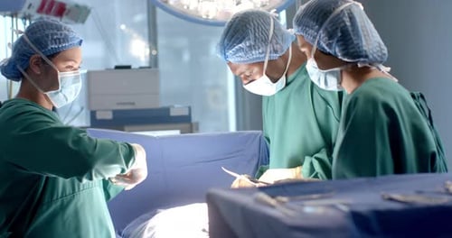 Medical Team Performing Surgery in Operating Room