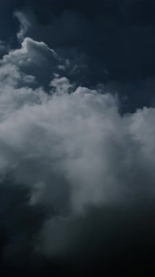 Vertical Aerial Shot of Clouds Moving Through Sky