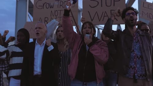 People Protesting Peacefully With Megaphone and Signs