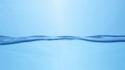 Water waves on surface with blue background_slow motion