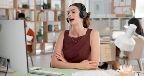 Smiling woman on video call in office setting