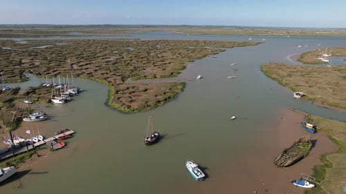 Aerial Panoramic View Of Boats Mooring In Tollesbury Marina With Salt Marshes In Essex, United King