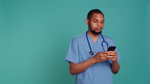Healthcare Worker Using Smartphone to Text Friends
