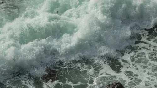 Waves Crashing Ocean Water Rocks Breaking for Dramatic Coastal Power