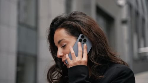Caucasian Young Female Working Remotely on Her Computer Outdoors in City Center Around Office