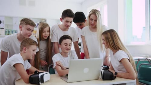 Students Collaborate with VR Headsets and Laptop