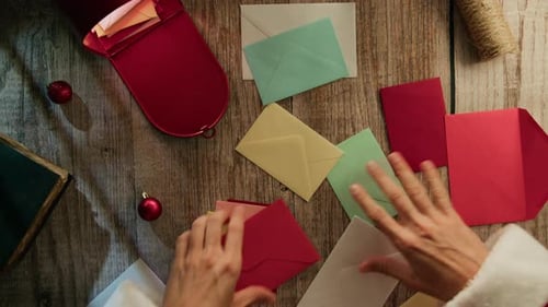 Sorting Christmas Mail in Santa Suit
