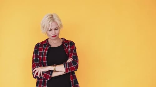 Woman Checking Watch with Arms Crossed