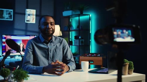 Young Adult Vlogger Recording Video in Studio