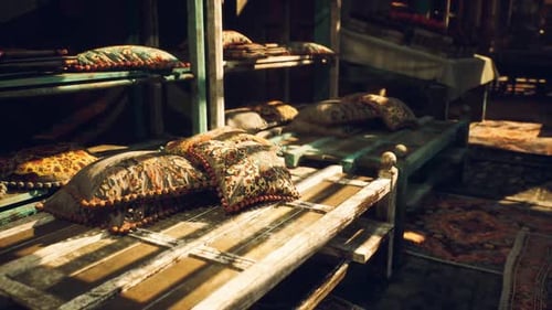 Colorful Decorative Pillows Showcased on Rustic Wooden Shelves in a Market