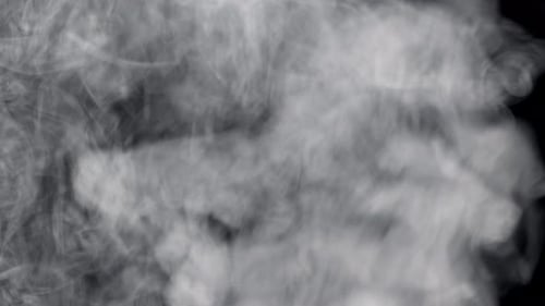 Abstract White Smoke Billows on Black Background