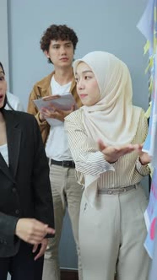 Business Team Discusses Ideas in a Modern Office