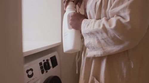 Adults Doing Laundry in a Laundry Room
