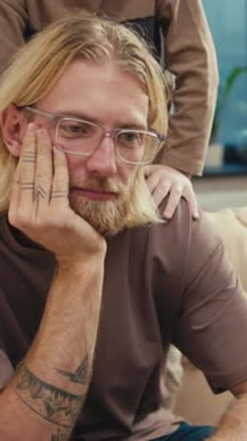 Tired Blond Dad in Glasses Does Not React to the Fact That His Son Wants Attention at Home