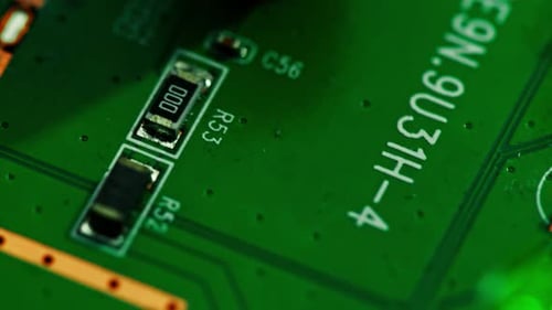 Green printed circuit motherboard components microchips CPU processor transistors semiconductors
